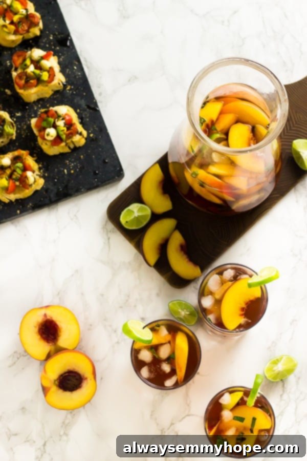 Overhead view of peach sangria in 3 glasses and pitcher