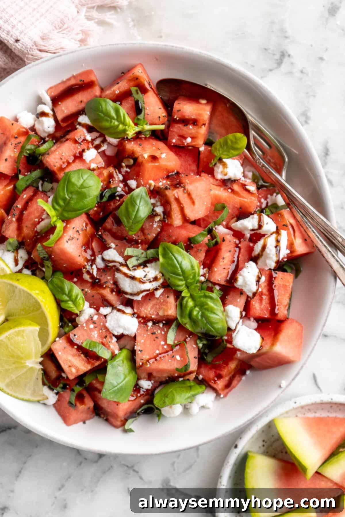 Overhead view of vegan watermelon feta salad in serving bowl