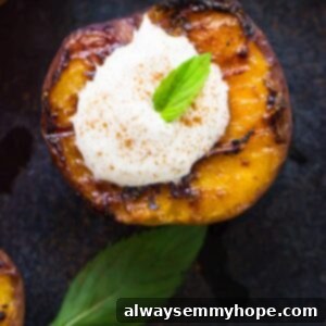 Flame-Kissed Fruit with Coconut Dream 7 Top down shot of grilled fruit topped with coconut cream on a grey slate.