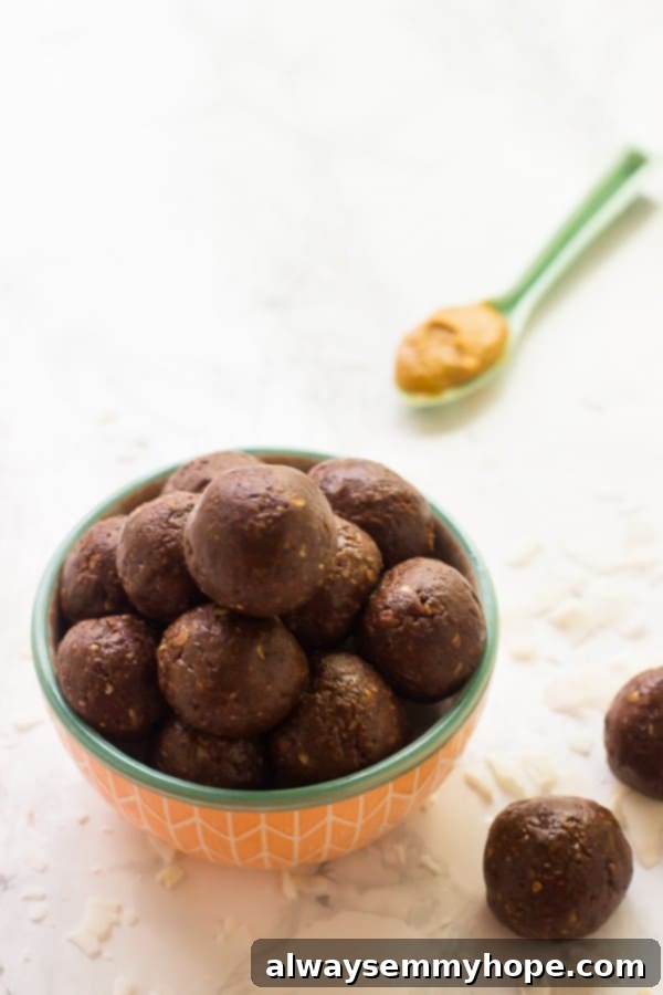 Close-up shot of a bowl of delicious, round peanut butter energy balls, ready for snacking.