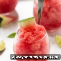 Side on shot of watermelon granita in a glass.
