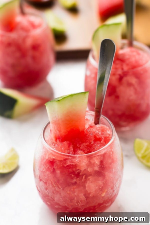 Watermelon granita in a glass with a slice of watermelon. 