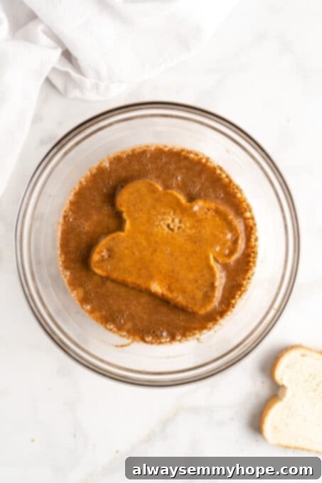 Pumpkin French toast being coated in batter
