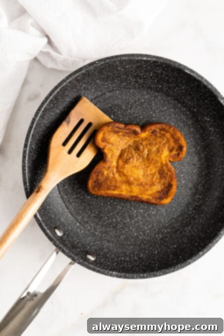 Pumpkin French toast being cooked in skillet
