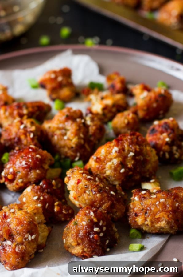 These Sticky Spicy Sesame Cauliflower Wings are the best veggie wings I've ever had! Loaded with a maple sesame flavor and spice, they are the perfect game day snack for vegans!