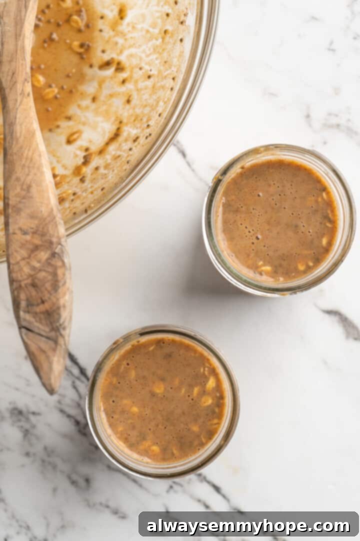 ingredients for overenight oats poured into smaller bowls or jars, ready for refrigeration