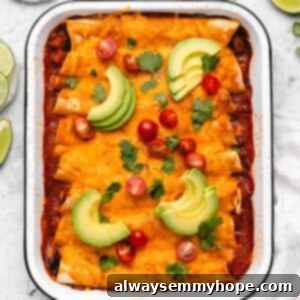 Baked vegan enchiladas with avocado and tomatoes.