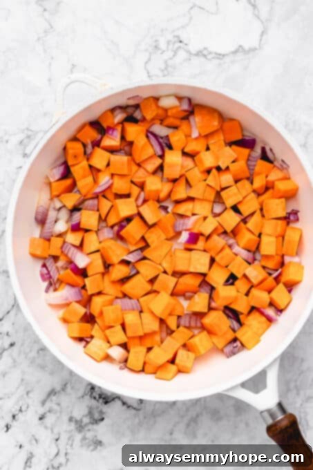 Sweet potato and onion in a pan.
