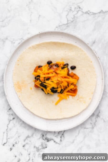 Sweet potato and black bean mixture on a tortilla.