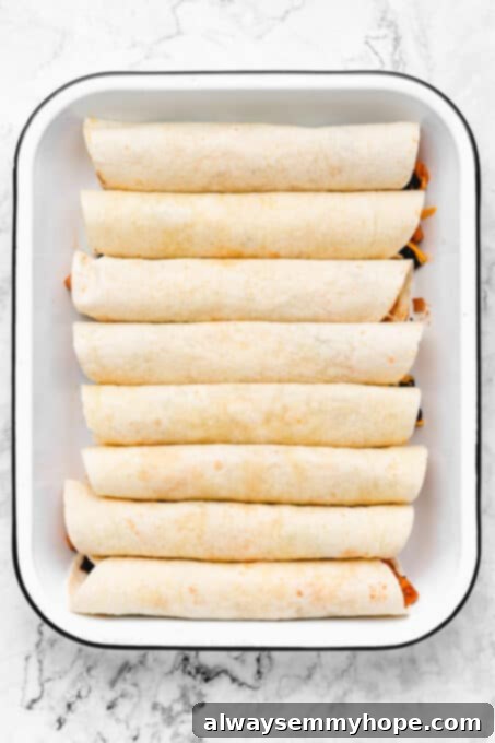 Baking dish of stuffed tortillas.