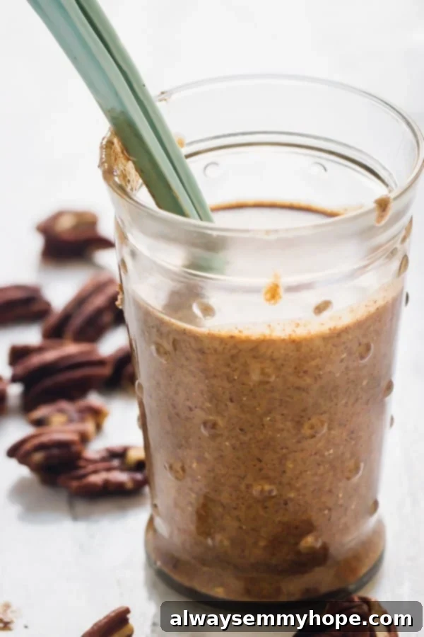 Freshly Made Homemade Pecan Butter in a Jar A jar of homemade pecan butter, clearly showcasing its smooth texture and rich color, ready for use.
