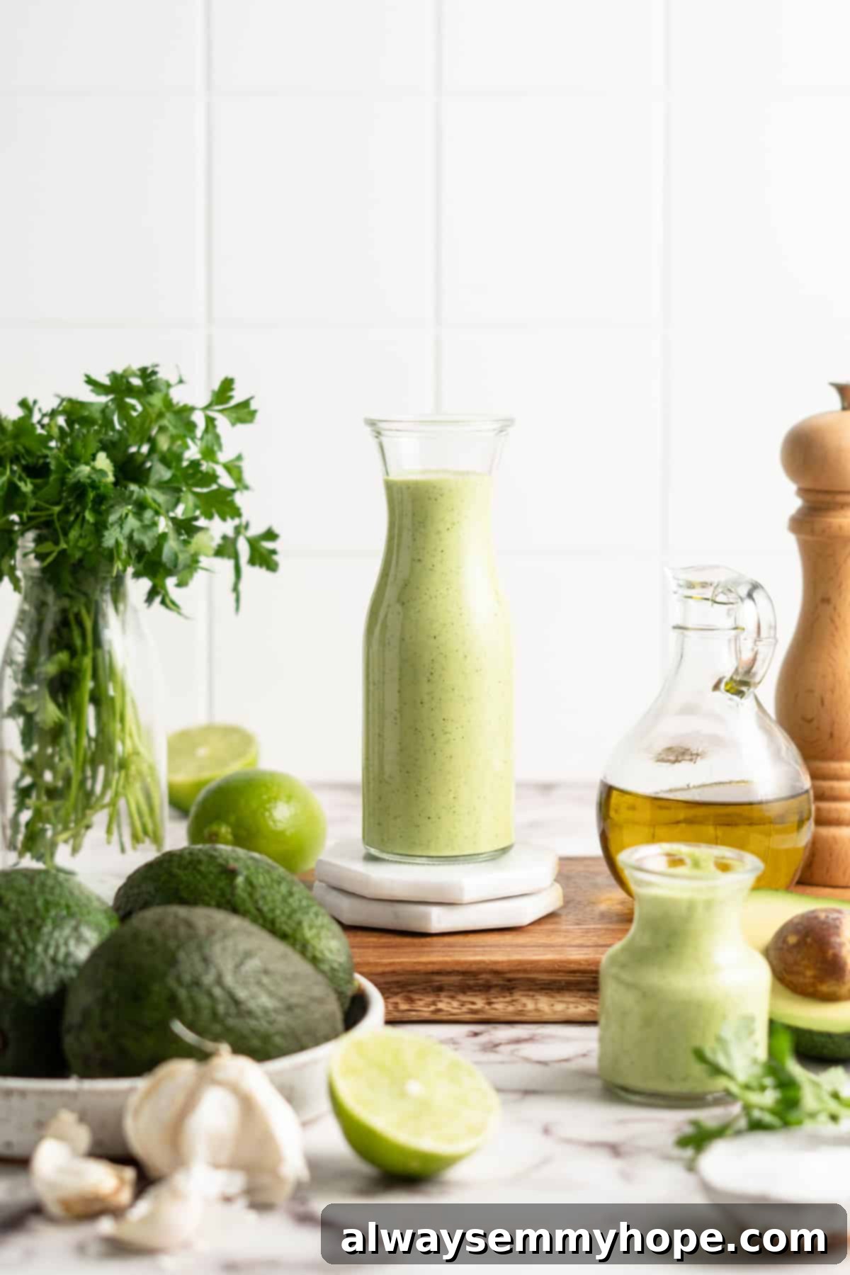 Naturally Creamy Vegan Avocado Dressing 2 Two glass jars filled with vibrant green creamy vegan avocado dressing, ready for serving over salads or as a dip.