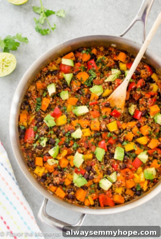 Quick Fall Vegan Dinners: 25 Recipes Ready in 15 Minutes 11 Overhead shot of a one-pot Mexican black bean sweet potato quinoa in a silver pot with a wooden spoon.