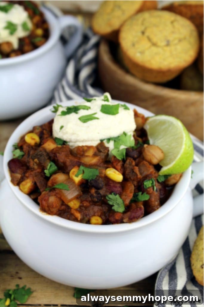 Quick Fall Vegan Dinners: 25 Recipes Ready in 15 Minutes 17 Side shot of a hearty bowl of chili in a little white bowl with a wedge of lime.