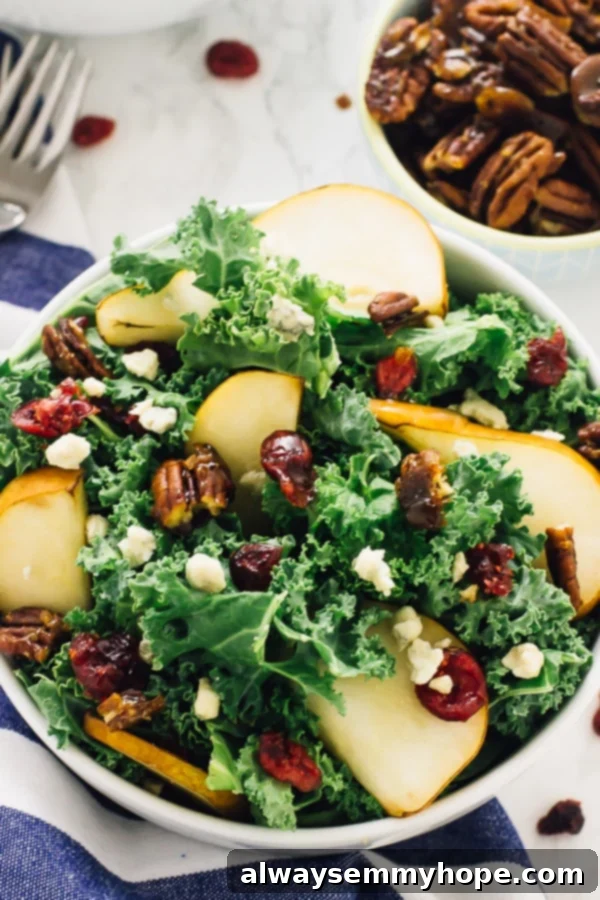 With candied pecans and a tangy apple cider vinaigrette, this easy pear and gorgonzola salad has the perfect balance of flavours! Close-up of a bowl of pear and gorgonzola salad, showcasing the fresh ingredients and vibrant colors.