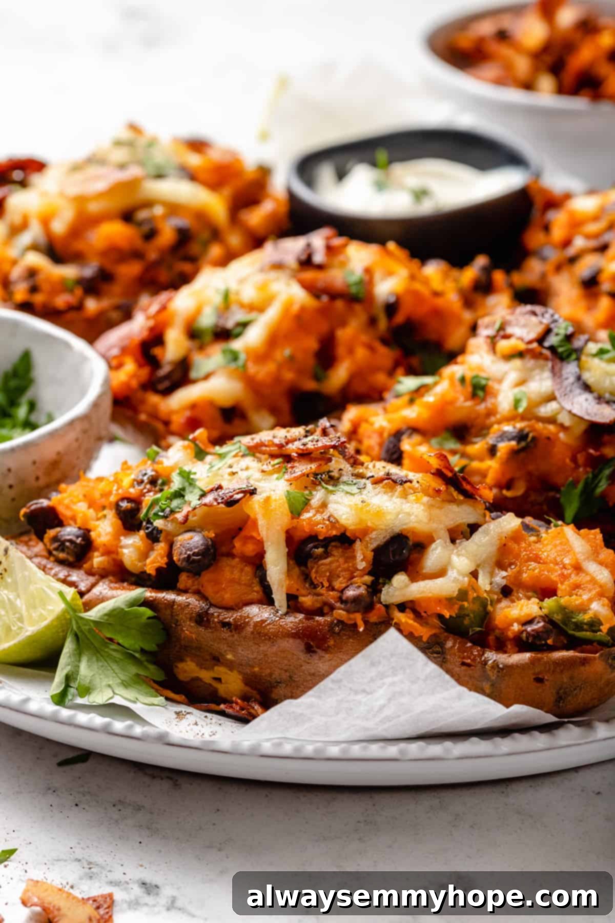 Stuffed Sweet Potato Skins 12 Loaded sweet potato skins on plate with sauce and garnishes