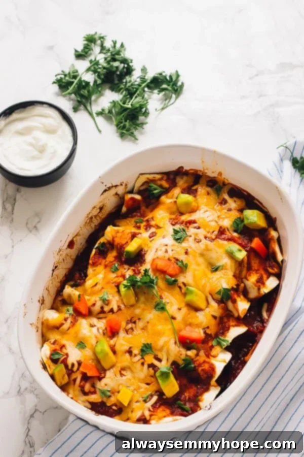 Stuffed Sweet Potato Skins 17 Top down shot of sweet potato and black bean enchiladas in a white baking dish.