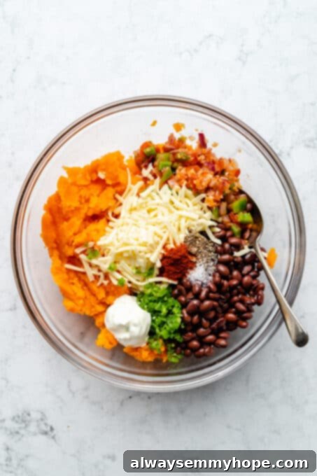 Stuffed Sweet Potato Skins 8 Overhead view of sweet potato skin filling ingredients in glass bowl before stirring