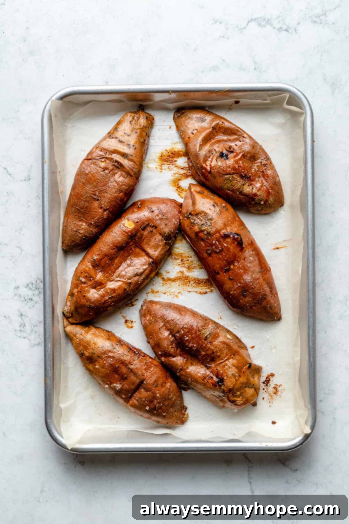 Stuffed Sweet Potato Skins 10 Overhead view of sweet potato skins cut-side-down on baking sheet