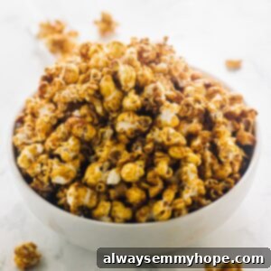 Irresistible Vegan Caramel Popcorn 2 A bowl full of vegan salted caramel popcorn.