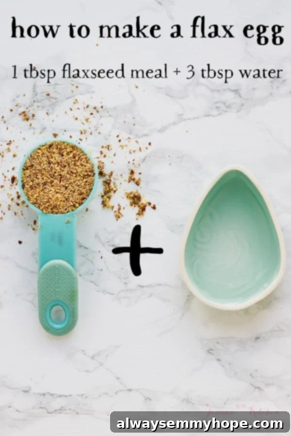 Top down shot of flax seeds in a spoon next to an egg shaped bowl. 