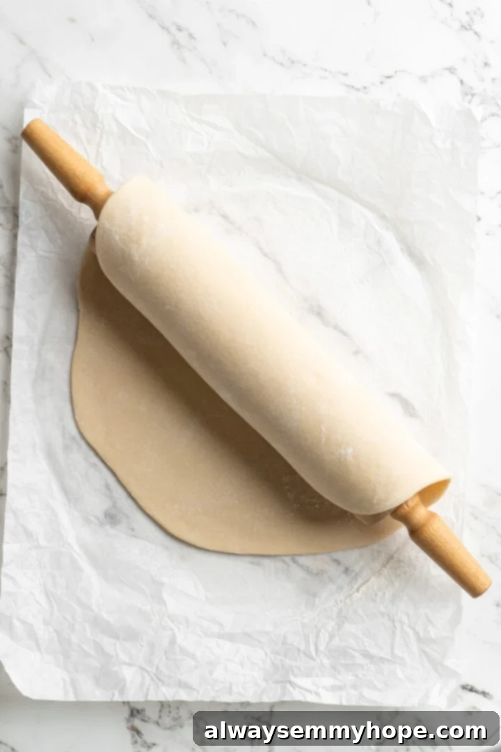 Easy 9-Ingredient Vegan Pumpkin Pie 3 rolled out pie dough over rolling pie