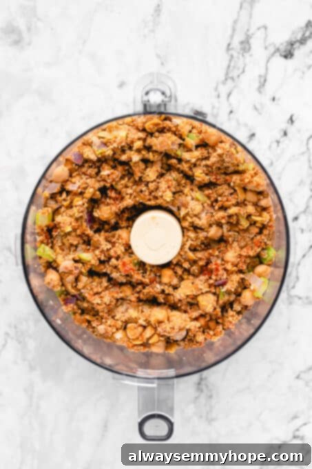 This vegan meatloaf makes a perfect Thanksgiving main dish or entree! It's moist and full of flavor, with just 15 minutes of prep. Dig in! Vegan meatloaf mixture inside the food processor.