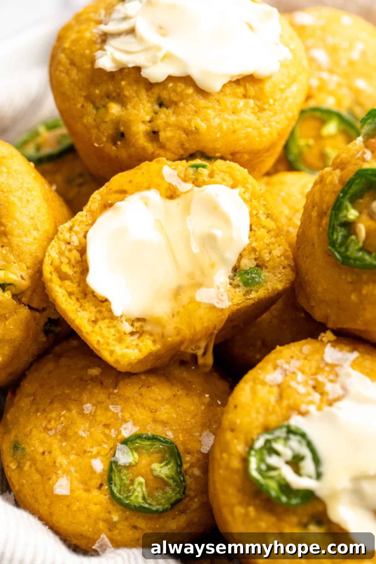 These moist vegan jalapeño cornbread muffins are easy to make and have a gluten-free option, which means everyone can enjoy them! Vegan cornbread muffins topped with butter and flaky salt.
