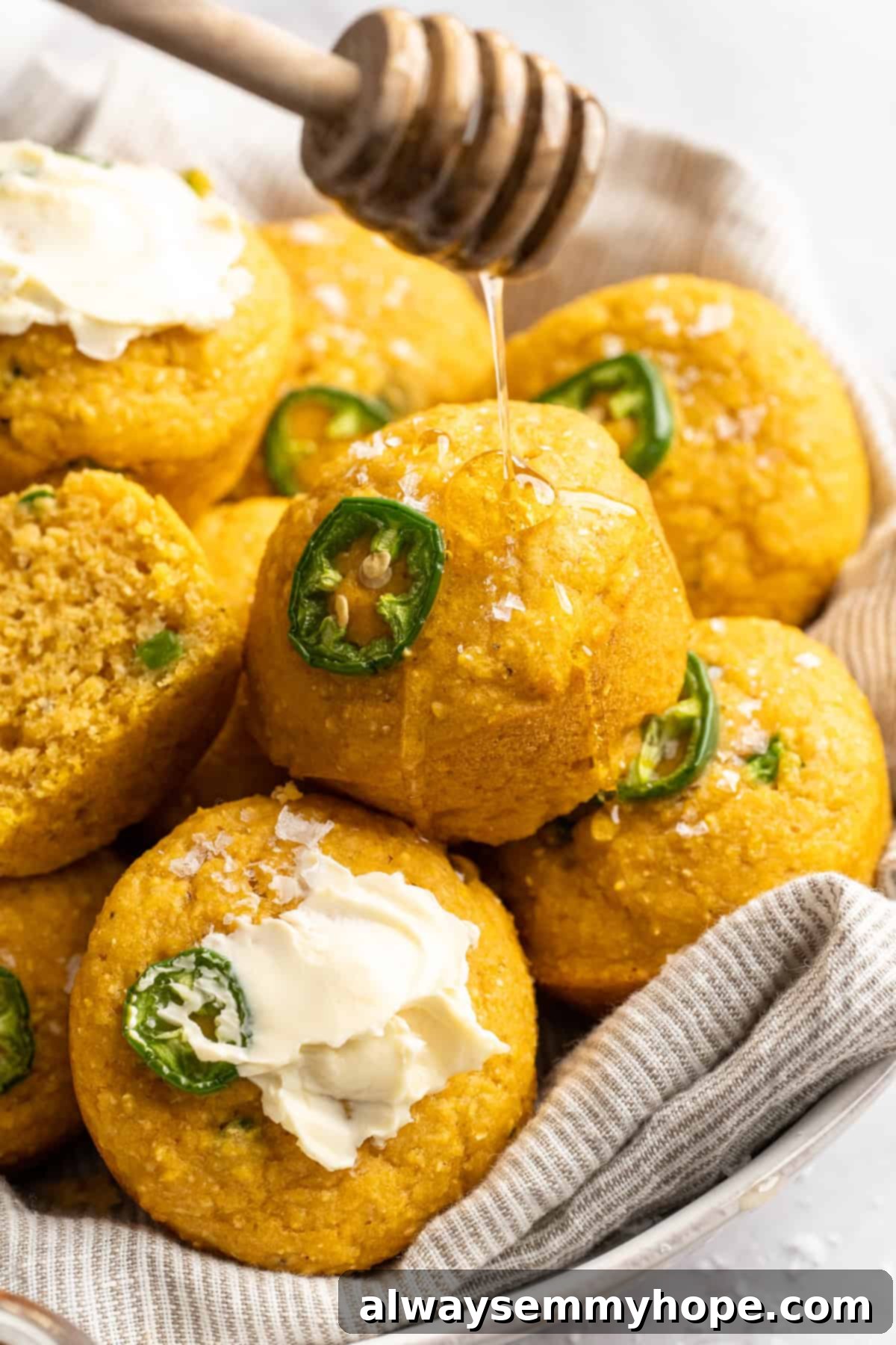 These moist vegan jalapeño cornbread muffins are easy to make and have a gluten-free option, which means everyone can enjoy them! Drizzling vegan honey over cornbread muffins.
