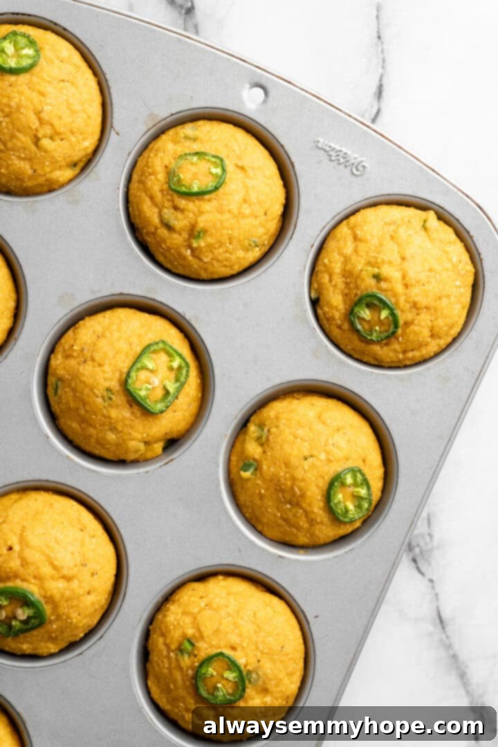 These moist vegan jalapeño cornbread muffins are easy to make and have a gluten-free option, which means everyone can enjoy them! Jalapeno cornbread muffins in pan.