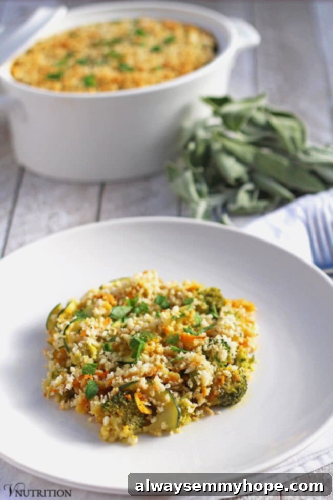 A slice of pumpkin vegetable bake on a white plate with casserole in the background. 