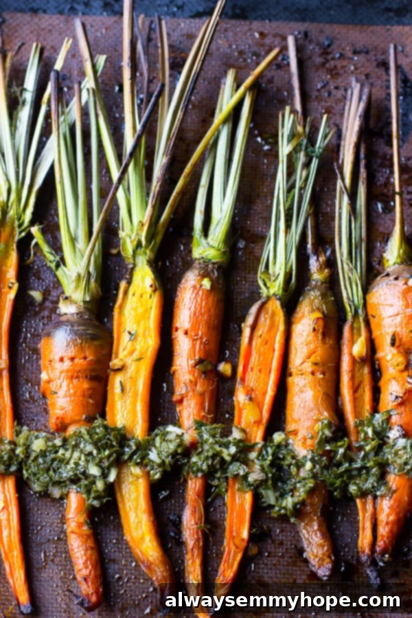 Overhead shot of maple garlic roasted carrots on a baking sheet. 
