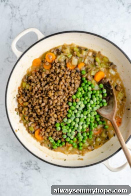 Hearty Vegan Shepherd's Pie 9 Overhead shot of the completed hearty lentil and mushroom Shepherd's Pie filling in a large Dutch oven, ready for assembly