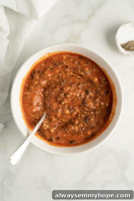 Overhead view of bowl of lasagna filling for spaghetti squash boats