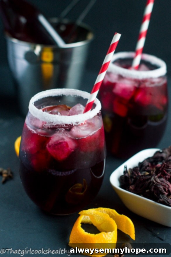 Vegan Christmas Delights: 50 Festive Plant-Based Meals 20 Two glasses of sorrel drink with red straws.