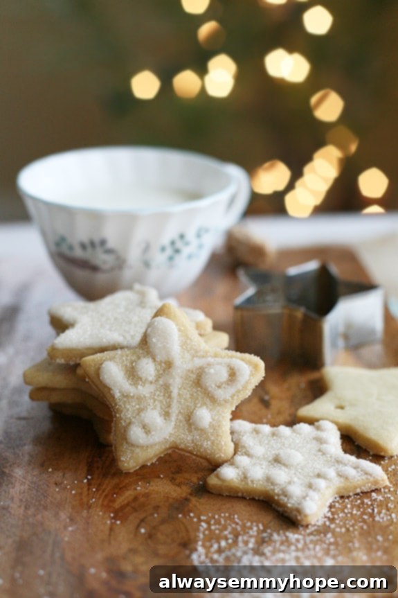 Vegan Christmas Delights: 50 Festive Plant-Based Meals 24 Vegan sugar cookies on a wood board.