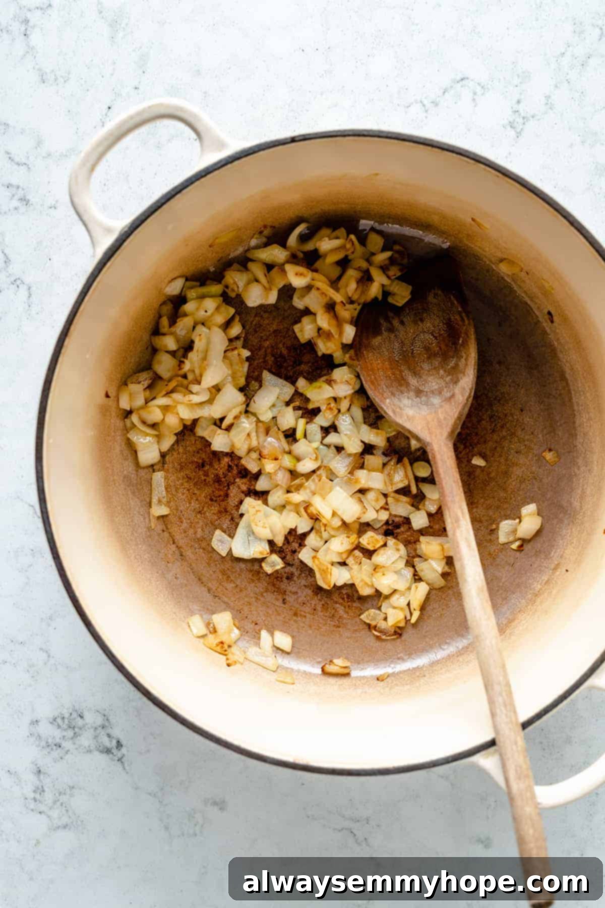 Velvety Roasted Cauliflower Soup 6 Sauteed onions in large pot with wooden spoon
