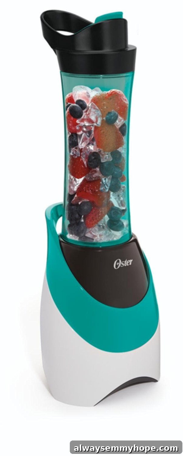 7 Simple and Speedy Vegan Banana Smoothies 4 A compact blue Oster My Blend blender with a travel bottle attachment, set against a pristine white background.