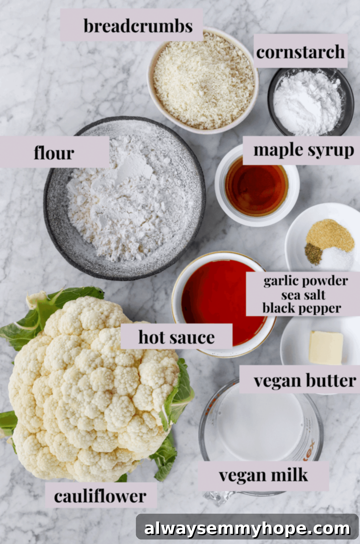 Buffalo cauliflower wings are the best vegan appetizer for game day! They're spicy and oven-baked to crispy perfection. Yum! A visual guide showing various ingredients for buffalo cauliflower wings, organized in separate bowls on a elegant marble surface.