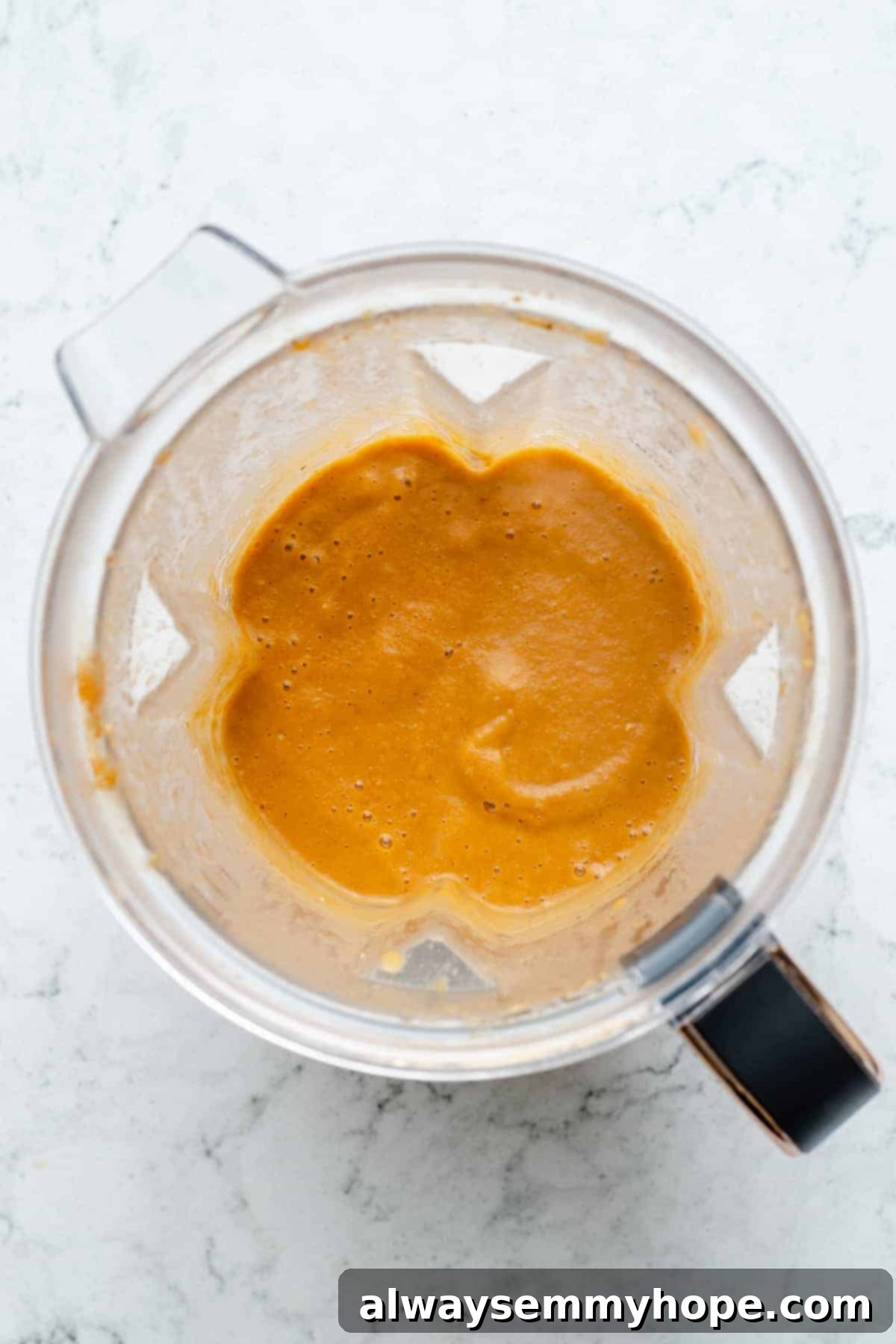 Overhead view of pureed soup in blender