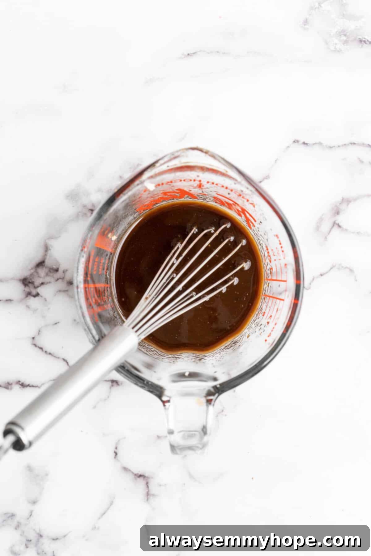 Easy Balsamic Roasted Vegetables 4 A small bowl of homemade balsamic marinade, perfectly emulsified and ready to be drizzled over fresh vegetables for roasting.