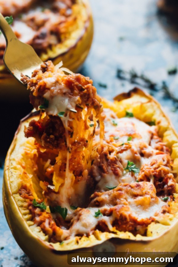 Fork pulling out some filling from a stuffed squash.