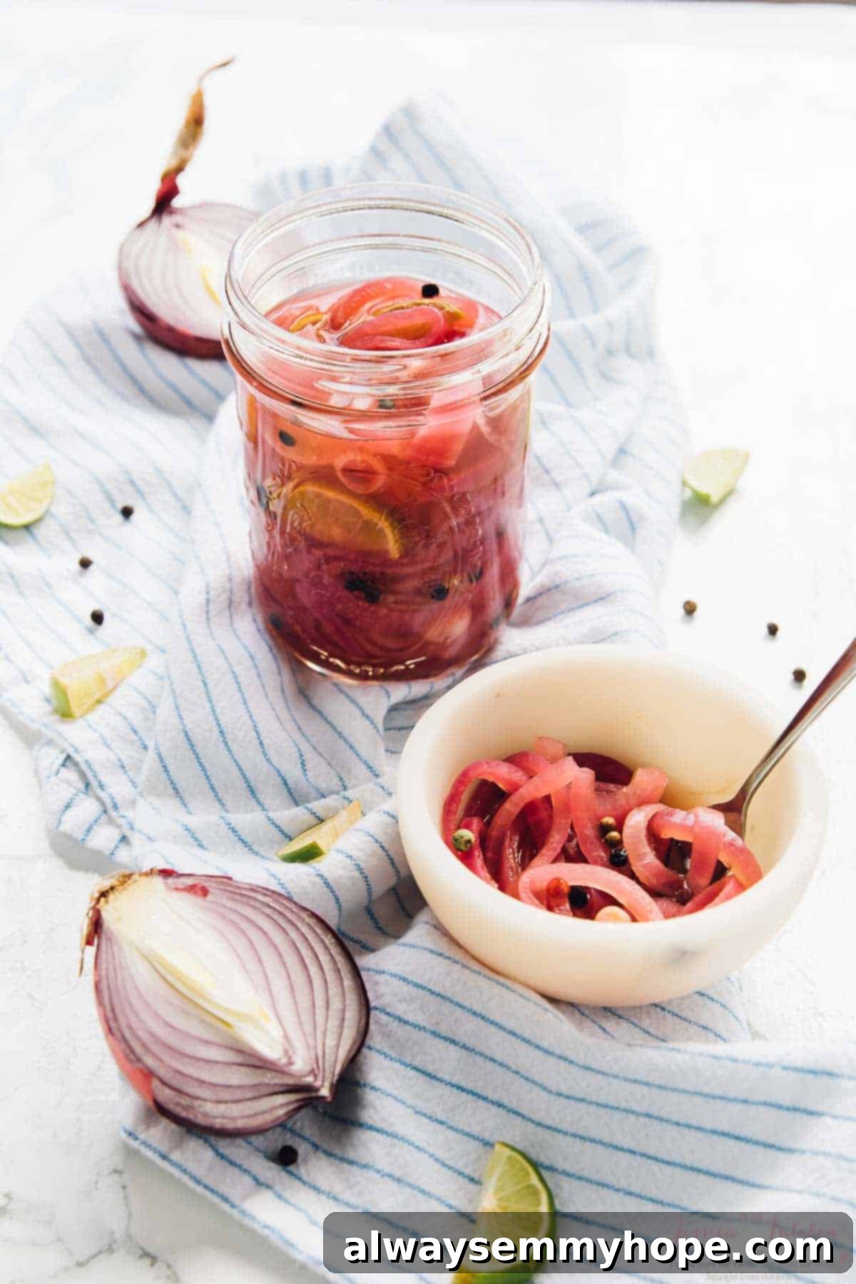 Quick pickled red onions in a bowl and a jar, ready for serving or storage.