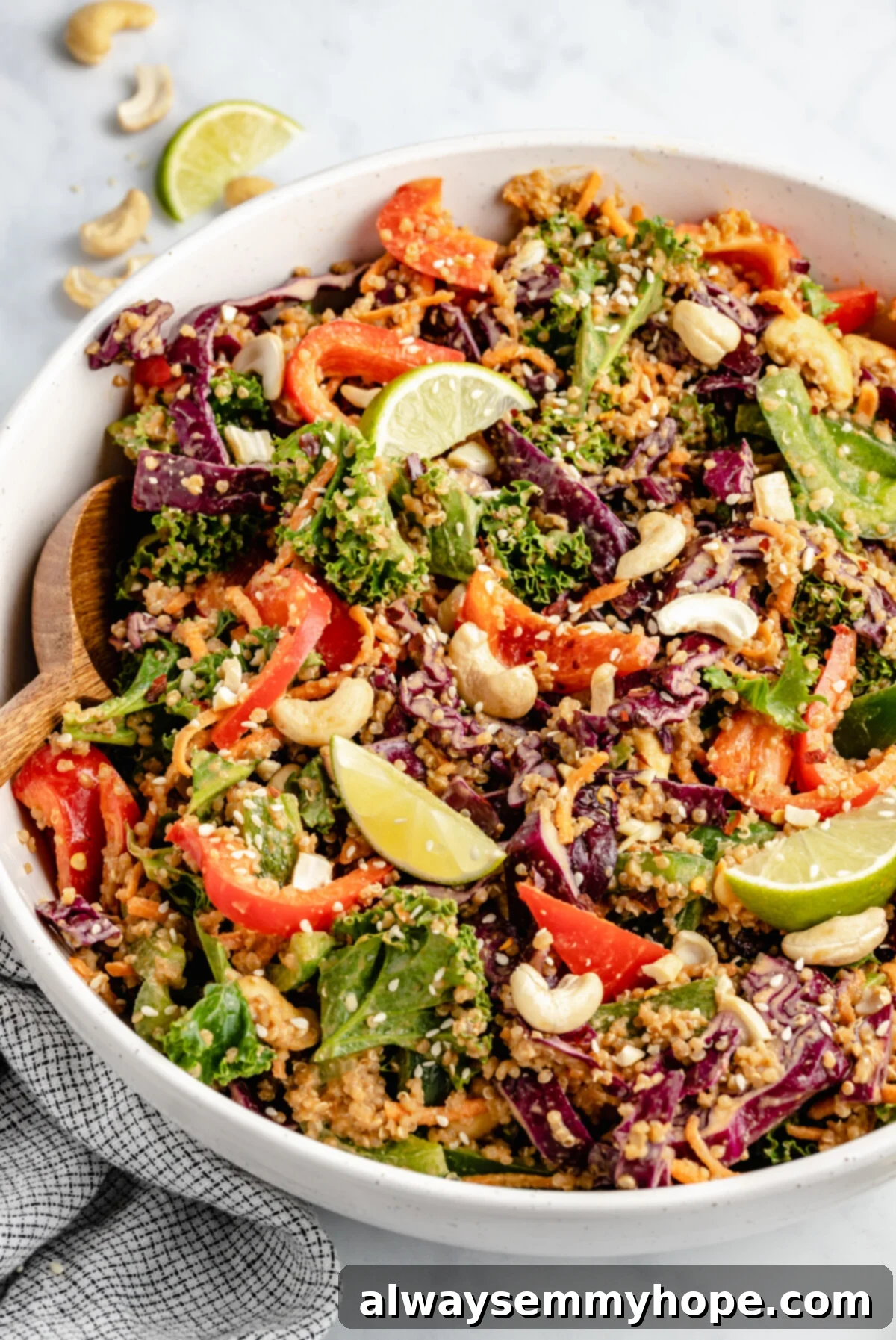 Enjoy a generous serving of homemade Thai quinoa salad, a healthy and delicious vegan meal perfect for any occasion. A large, rustic serving bowl brimming with vibrant Thai quinoa salad, showcasing its colorful ingredients and inviting texture.