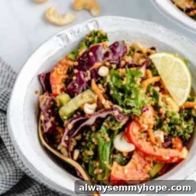 Vibrant Thai Quinoa Salad 2 Bowl of Thai quinoa salad with fork, ready to be enjoyed.