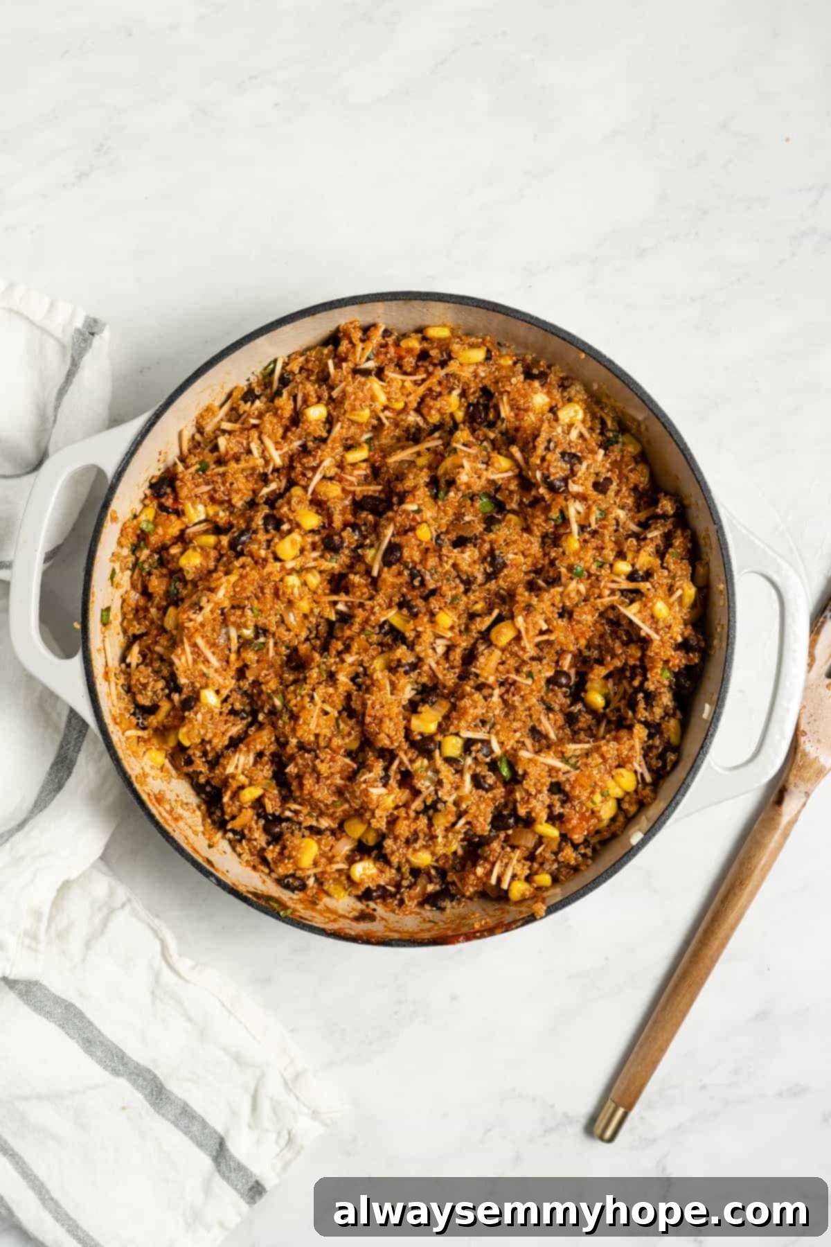 The fully mixed, savory filling for stuffed bell peppers resting in a pan, ready for assembly.