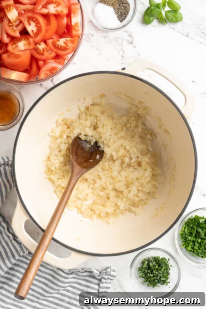 Freshly chopped onions in a large pot, prepared for sautéing as the base of a delicious homemade tomato sauce. Overhead view of chopped onions in a large pot, ready to be sautéed for homemade tomato sauce