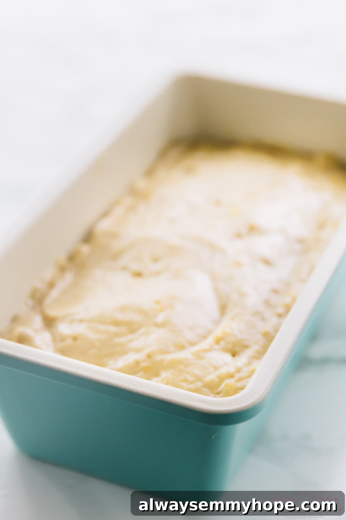 This is the best gluten-free vegan banana bread! Soft, moist, and easy to make with simple ingredients. Enjoy it with your favorite mix-ins! Vegan gluten-free banana bread batter in loaf pan
