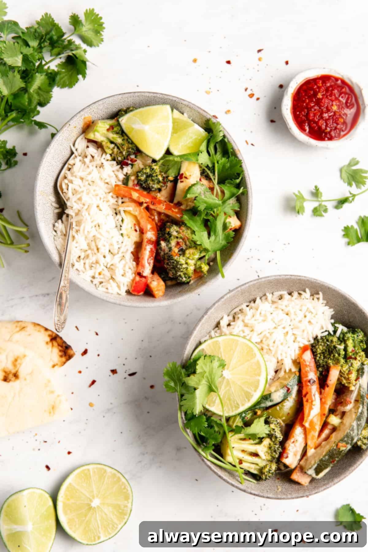 Effortless Thai Green Curry 14 Two inviting bowls of vegan Thai green curry, garnished with fresh lime wedges, ready to be enjoyed.