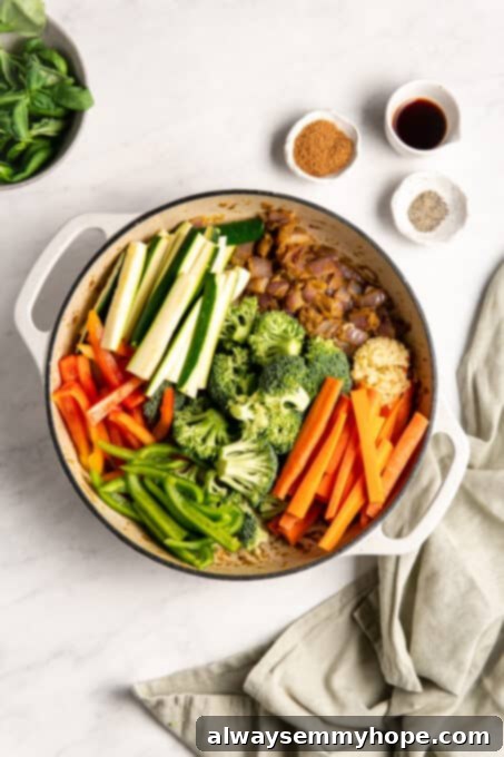 Effortless Thai Green Curry 7 A colorful medley of chopped vegetables added to the pan, ready to be cooked down.